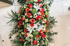 Orange & white flowered coffin spray