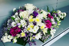 white & pink floral arrangement in whites, pinks & purples