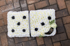 domino tribute with black dad ribbon sash