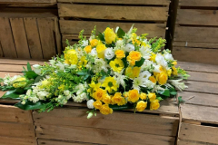 yellow funeral spray