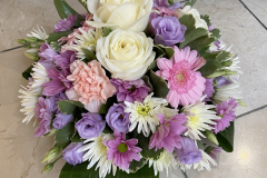 Pastel coloured funeral posy