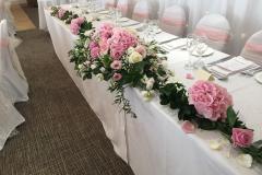 8ft top table wedding display created with soft pink & white flowers.