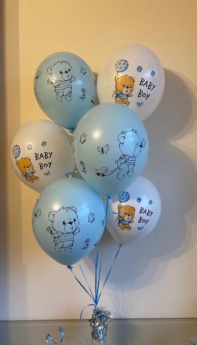 A mixture of 6 balloons in blue & white. With printed Teddys & "baby boy" quotes.