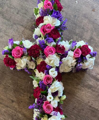 Funeral Cross Tribute covered in a mix of flowers of your choice.