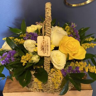 Seasonal flowers in a wicker basket.